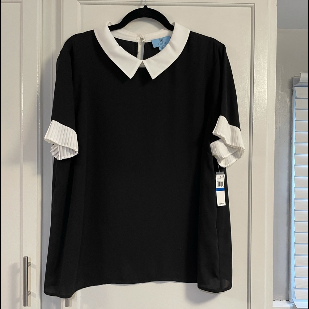 New with tags.  CeCe supper blouse black and white